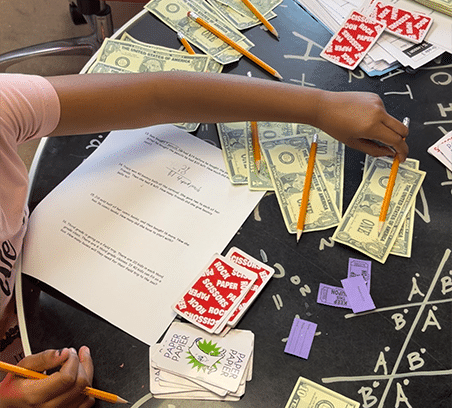 Clairmont Advanced student playing a money management game to build financial literacy.